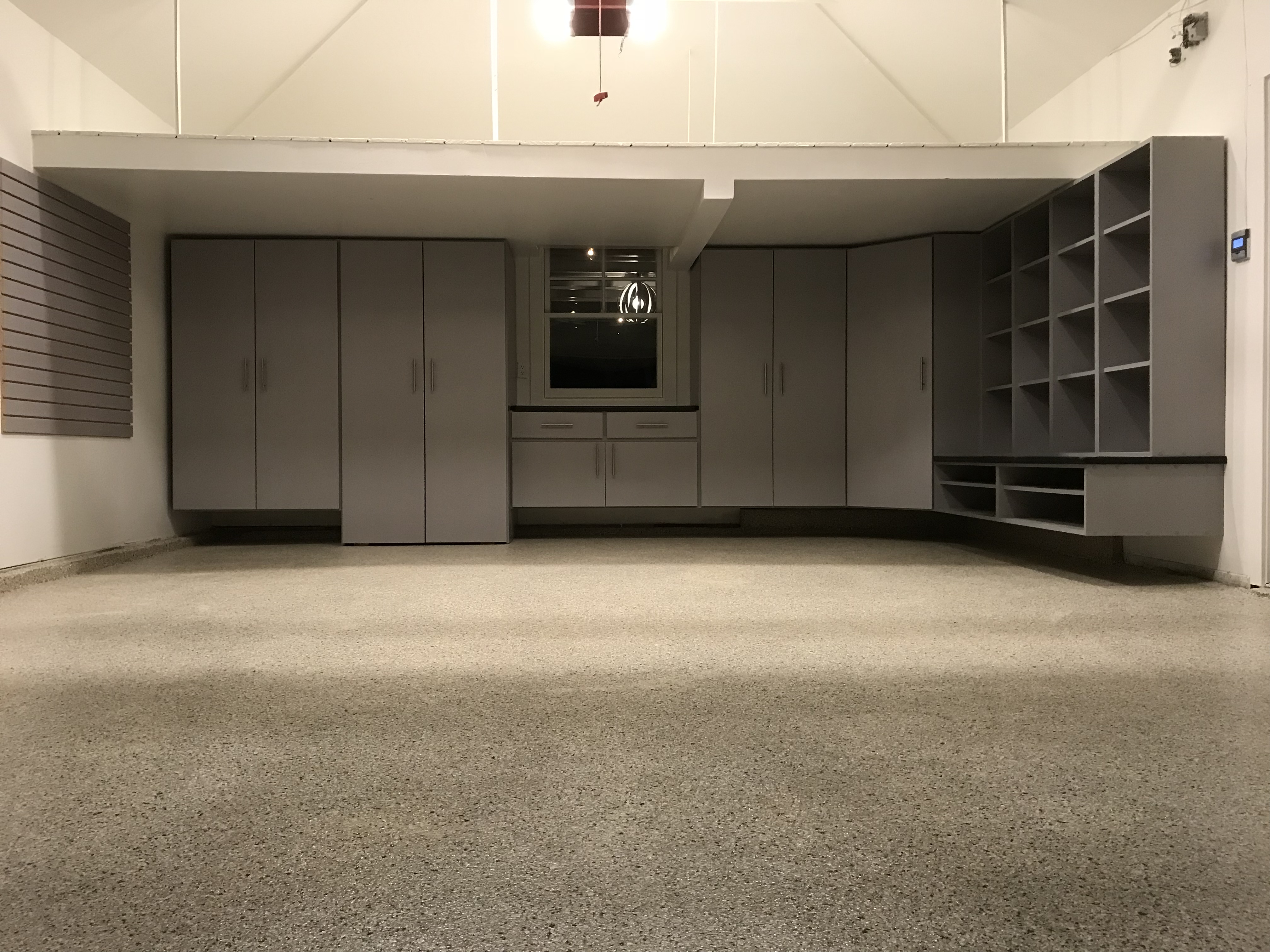 Garage storage system with slatwall and built-in cabinets